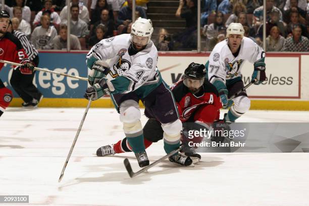 Rob Niedermayer of the Anaheim Mighty Ducks skates against Scott Niedermayer of the New Jersey Devils during Game Six of the 2003 Stanley Cup Finals...