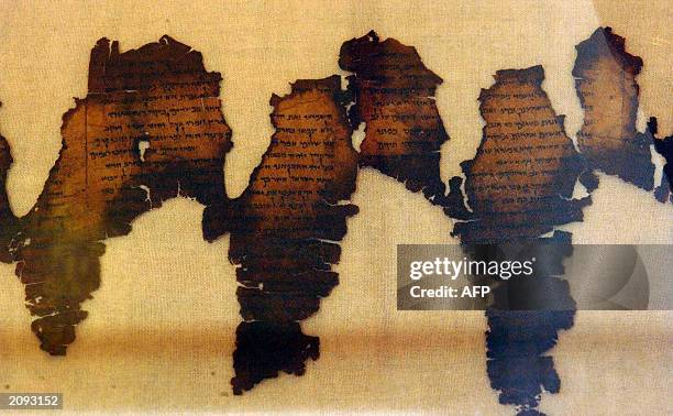 Fragments of the Dead Sea Scrolls, considered one of the greatest archeological discoveries of the 20th century, are displayed 18 June 2003 at...