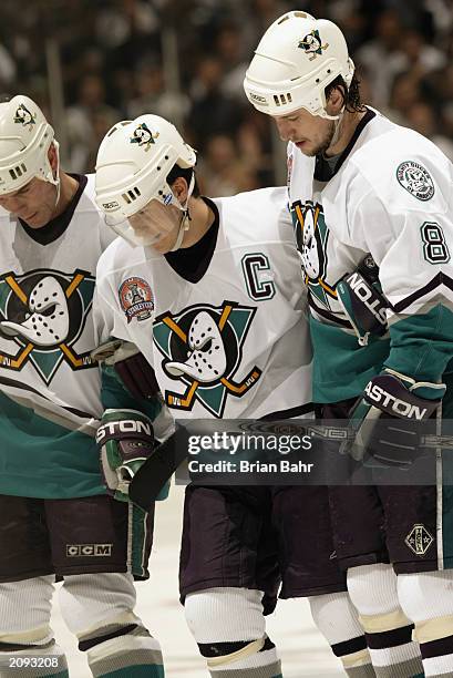 Paul Kariya of the Anaheim Mighty Ducks is helped off the ice after being hit by Scott Stevens of the New Jersey Devils during Game Six of the 2003...