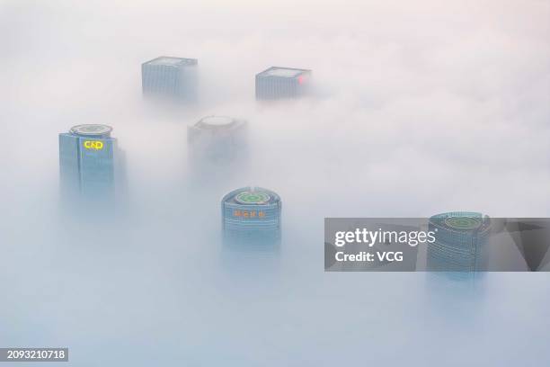 Buildings are seen amid advection fog on March 17, 2024 in Xiamen, Fujian Province of China.