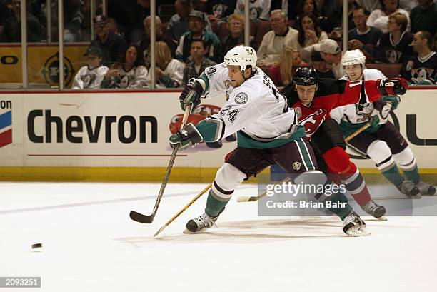 Ruslan Salei of the Anaheim Mighty Ducks feeds the puck during Game Six of the 2003 Stanley Cup Finals against the New Jersey Devils at the Arrowhead...