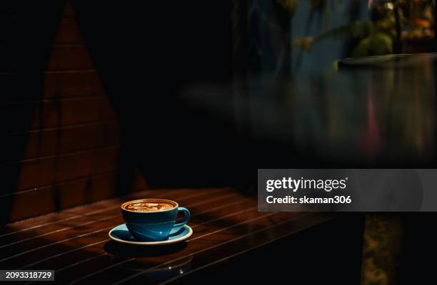 coffee culture chic: embracing luxury in a designer cafe ambiance - gift bag stock pictures, royalty-free photos & images