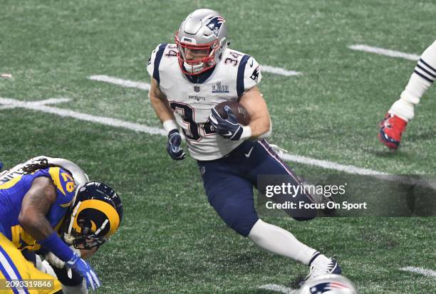 Rex Burkhead of the New England Patriots carries the ball against the Los Angeles Rams in the second half of Super Bowl LIII on February 3, 2019 at...