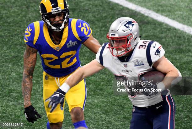 Rex Burkhead of the New England Patriots running with the ball pursued by Marcus Peters of the Los Angeles Rams in the second half of Super Bowl LIII...