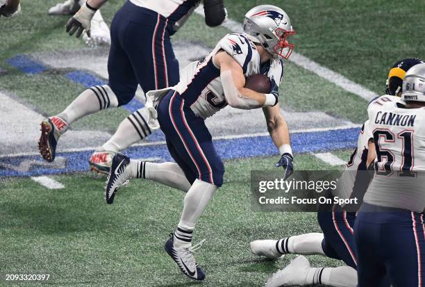 Rex Burkhead of the New England Patriots carries the ball against the Los Angeles Rams in the second half of Super Bowl LIII on February 3, 2019 at...