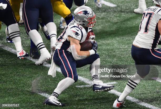 Rex Burkhead of the New England Patriots carries the ball against the Los Angeles Rams in the first half of Super Bowl LIII on February 3, 2019 at...