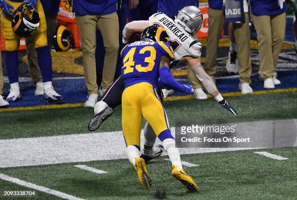 Rex Burkhead of the New England Patriots gets tackled out of bounds by John Johnson of the Los Angeles Rams in the first half of Super Bowl LIII on...