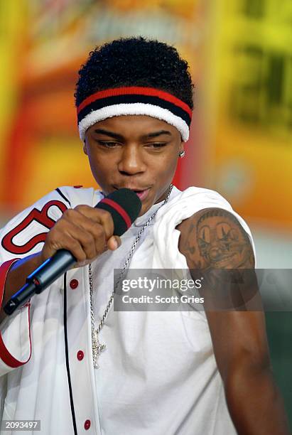 Bow Wow shows off his new tattoo on stage during MTV's Total Request Live June 18, 2003 at the MTV Times Square Studios in New York City.