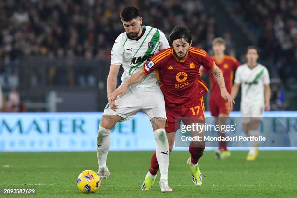 The Roma player Sardar Azmoun and the Sassuolo player Martin Erlic during the match Roma v Sassuolo at the Stadio Olimpico. Rome , March 17th, 2024