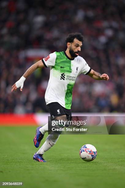 Mohamed Salah of Liverpool running down the wing during the Emirates FA Cup Quarter Final match between Manchester United and Liverpool at Old...