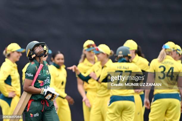 Australia's players celebrate after the dismissal of Bangladesh's Sobhana Mostary during the first one-day international cricket match between...