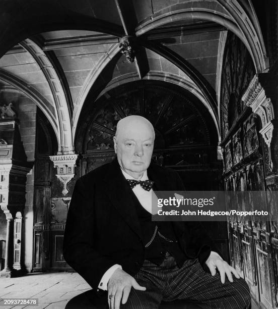 British statesman and former prime minster Sir Winston Churchill posed in the grand lobby of a building in London in 1957.