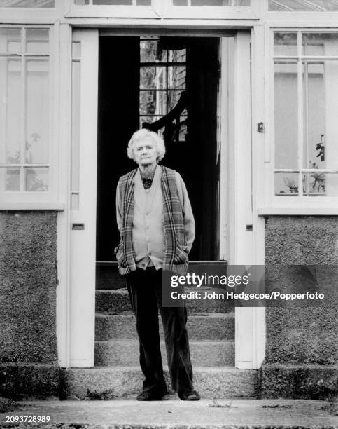 English novelist, writer and playwright Daphne du Maurier stands outside the front door of her home, Kilmarth House in Fowey, Cornwall in 1987.