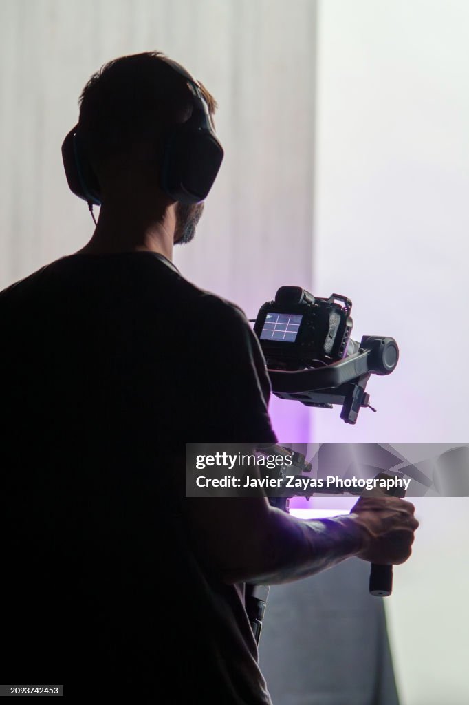 Camera man at Work Using Gimbal (Indoors)