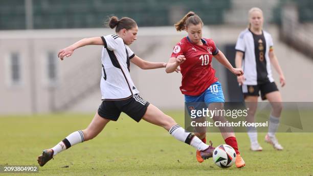 Maj Schneider of Germany challenges Lucie Kroupova of Czechia during the UEFA U17 Girls Elite Round match between the Czech Republic and Germany at...
