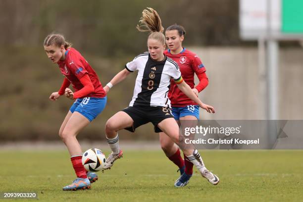 Denisa Rancova of Czechia and Nikola Sotova of Czechia challenge Greta Hünten of Germany during the UEFA U17 Girls Elite Round match between the...