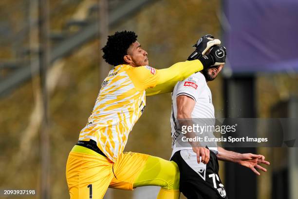 Goalkeeper Hugo de Souza of Chaves defends the ball from Nelson Oliveira of Vitoria during the Liga Portugal Betclic match between GD Chaves and...