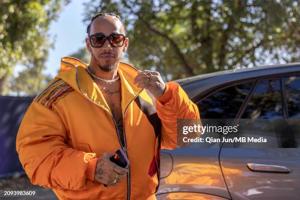 Lewis Hamilton of Great Britain and Mercedes-AMG PETRONAS F1 Team arrives at the track during previews ahead of the F1 Grand Prix of Australia at...