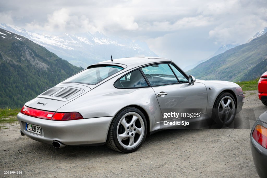 Porsche 911 sports car in the Alps