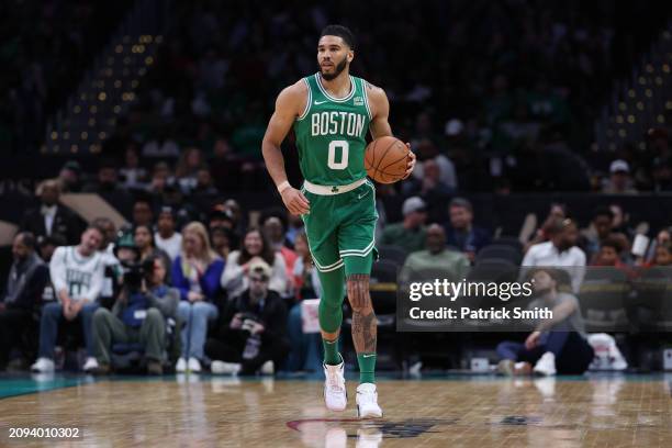 Jayson Tatum of the Boston Celtics dribbles the ball up the court against the Washington Wizards during the second half at Capital One Arena on March...