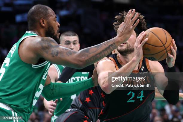 Corey Kispert of the Washington Wizards is guarded by Xavier Tillman of the Boston Celtics during the first half at Capital One Arena on March 17,...