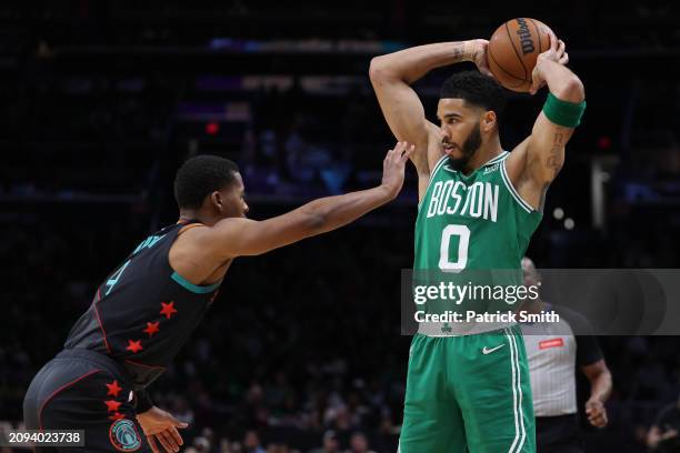Jayson Tatum of the Boston Celtics plays looks to pass against the Washington Wizards at Capital One Arena on March 17, 2024 in Washington, DC. NOTE...