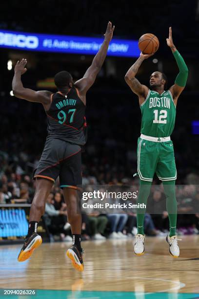 Oshae Brissett of the Boston Celtics shoots in front of Eugene Omoruyi of the Washington Wizards during the second half at Capital One Arena on March...