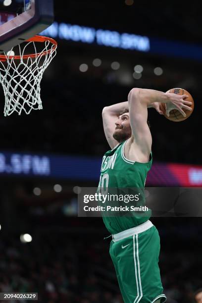 Luke Kornet of the Boston Celtics dunks against the Washington Wizards during the second half at Capital One Arena on March 17, 2024 in Washington,...