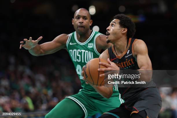 Jordan Poole of the Washington Wizards drives to the basket against the Boston Celtics at Capital One Arena on March 17, 2024 in Washington, DC. NOTE...