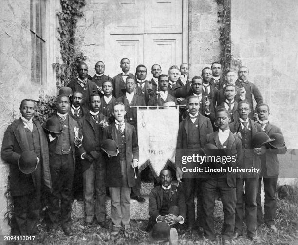 Portrait of Lincoln University students posing in front of the chapel on campus during their commencement ceremony in the 1800s.