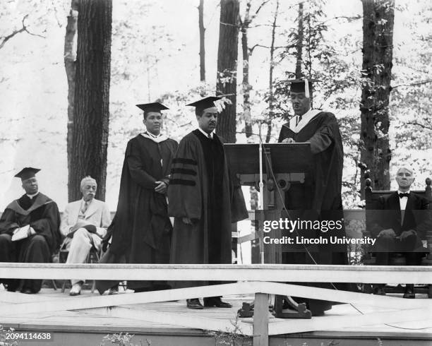 Joseph Newton Hill, dean of Lincoln University awarding American poet Langston Hughes and athlete Manuel Rivero with honorary degrees during a...