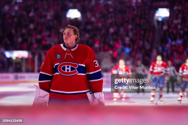 Cayden Primeau of the Montreal Canadiens stands during the American national anthem before the NHL regular season game against the Columbus Blue...