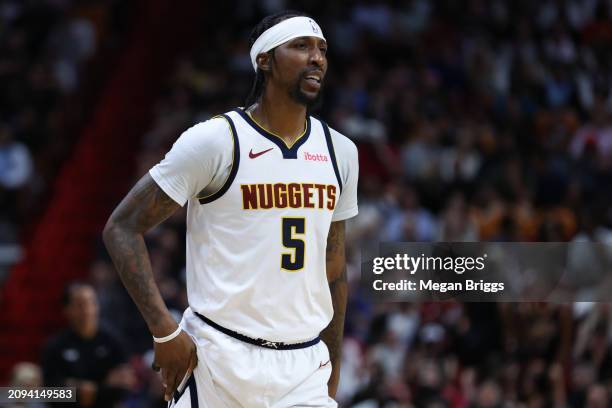 Kentavious Caldwell-Pope of the Denver Nuggets looks on against the Miami Heat during the second quarter at Kaseya Center on March 13, 2024 in Miami,...