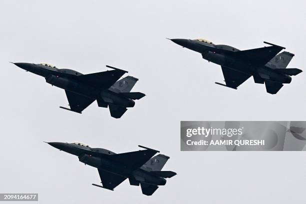 Pakistan Air Force JF-17 fighter jets perform at a rehearsal ahead of Pakistan's national day parade in Islamabad on March 21, 2024.