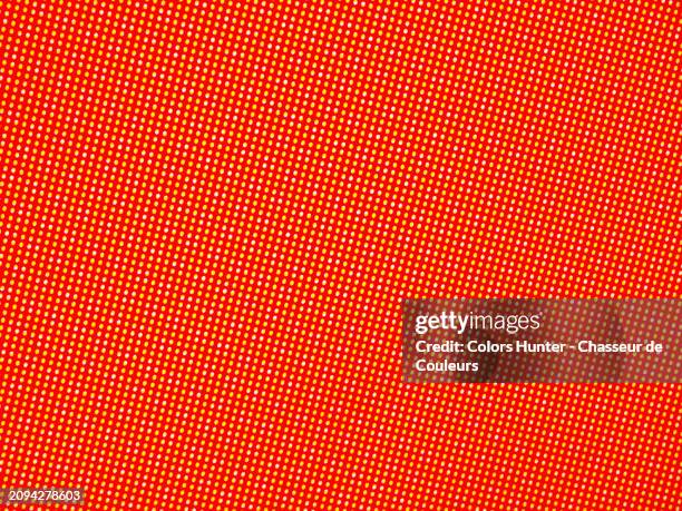 macro photograph of a poster printed in offset : mesh of yellow and white dots on a red background.natural and vivid colors. sunlight.full frame 4:3.paris, france. - billboard posting stock pictures, royalty-free photos & images