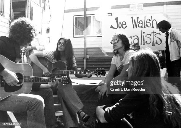 Singer and Songwriter Emmylou Harris rehearses with guitarist Rodney Crowell and singer Nicolette Larson in late 1975 prior to performance as the...