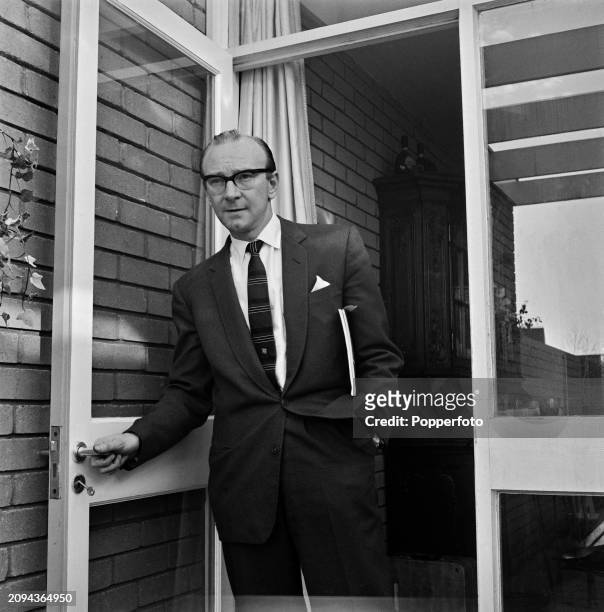 English television producer Bill Cotton in the doorway of his house on Beechrow at Ham Common near Richmond in London in June 1962. Bill Cotton is...