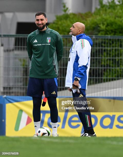 Head coach of Italy Luciano Spalletti and Gianluigi Donnarumma reacts during a Italy training session at Centro Sportivo Giulio Onesti on March 18,...