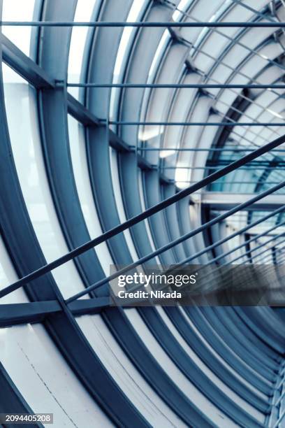 modern steel glass facade of paris airport passenger area - charles de gaulle airport stock pictures, royalty-free photos & images