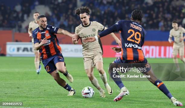Jordan Ferri of Montpellier in action with Vitinha of Paris Saint-Germain during the Ligue 1 Uber Eats match between Montpellier HSC and Paris...
