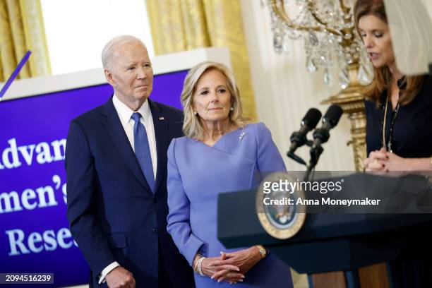 President Joe Biden and first lady Jill Biden listen as Maria Shriver, the former first lady of California, speaks during a Women’s History Month...