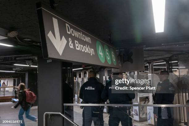 Officers patrol a Manhattan subway station on March 18, 2024 in New York City. Following a surge in crime on the subways, New York Governor Kathy...