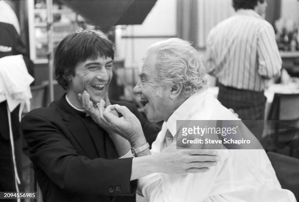 American actors Robert De Niro and Lionel Stander share a laugh on the set of the film 'The Gang That Couldn't Shoot Straight' , New York, New York,...