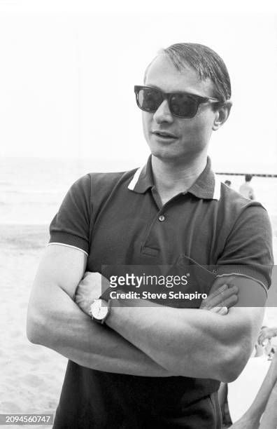 View of American artist Roy Lichtenstein at the beach during the Venice Biennale, Venice, Italy, 1966.