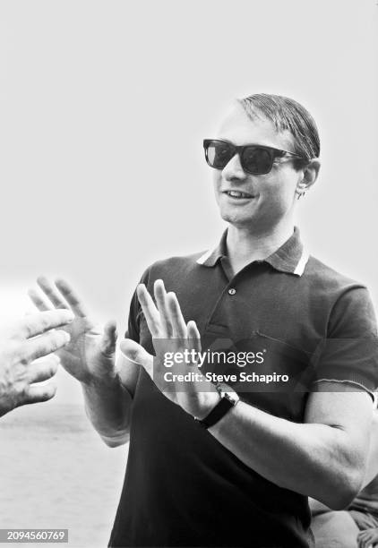 View of American artist Roy Lichtenstein at the beach during the Venice Biennale, Venice, Italy, 1966.