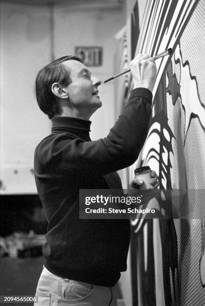 View of American artist Roy Lichtenstein as he paints 'Yellow and Green Brushstrokes', 1966.