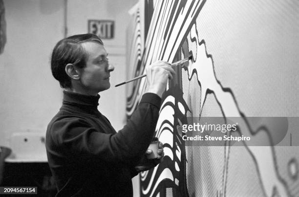 View of American artist Roy Lichtenstein as he paints 'Yellow and Green Brushstrokes', 1966.