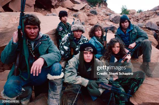 Portrait of cast members as they pose, in costume, for the movie 'Red Dawn' , New Mexico, 1984. Pictured are Patrick Swayze , Darren Dalton , Charlie...