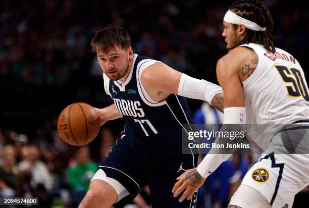 Luka Doncic of the Dallas Mavericks handles the ball against the Denver Nuggets in the second half at American Airlines Center on March 17, 2024 in...