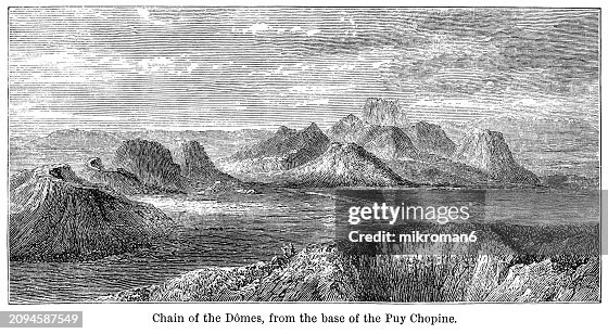 Old engraving illustration of the Chaîne des Puys, a north-south oriented chain of cinder cones, lava domes, and maars in the Massif Central of France (highest point is the lava dome of Puy de Dôme, located near the middle of the chain, which is 1,465 m)